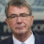 Trump signs an order to revise the pentagons policy on transgender troops